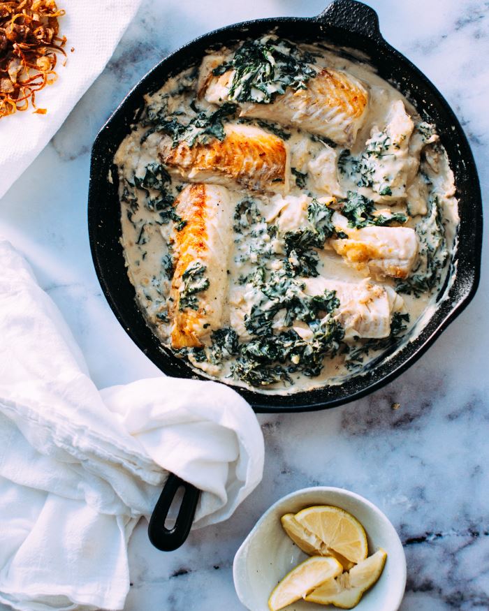 cooked fish and souce in skillet