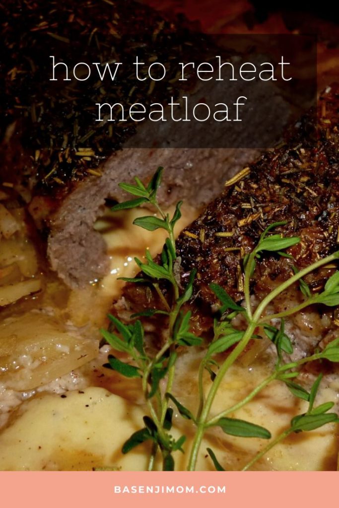 cut loaves of meatloaf with rosemary and baked potatoes