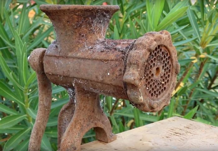 rusty antique meat grinder