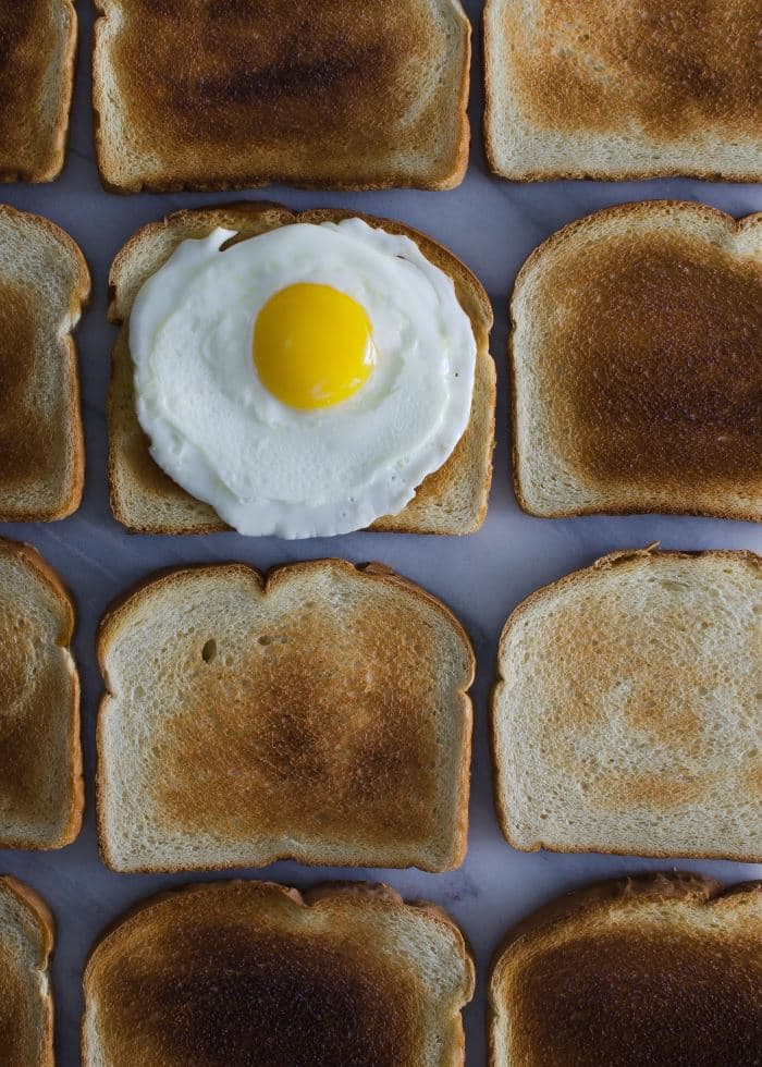 many slices of toasted bred and baked egg