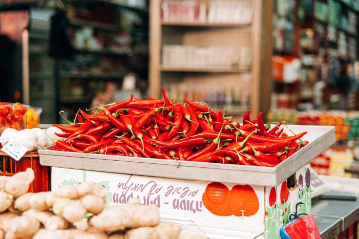 pile of red chili peppers in the box